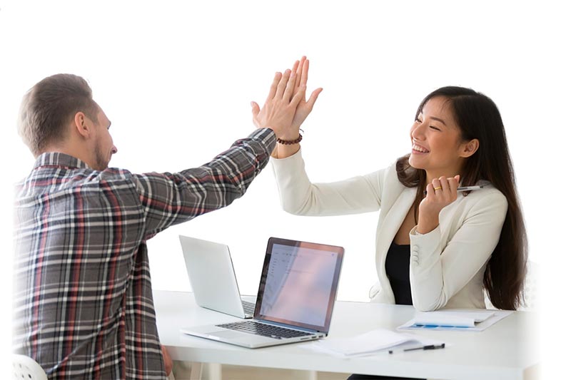 Nui Software SchoolsNZ Database Management - Man and woman high five over desk